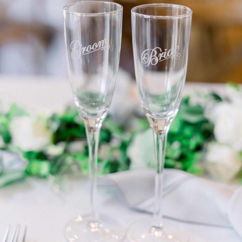 His&hers toasting bride and groom glasses